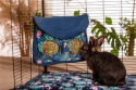 A hay rack with a flap "Tropikal Forest" for rabbits, guinea pigs, chinchillas, degus